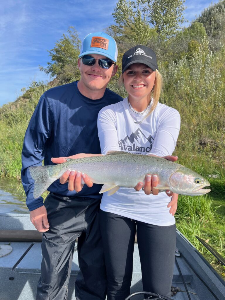 Women holding a Pike fish